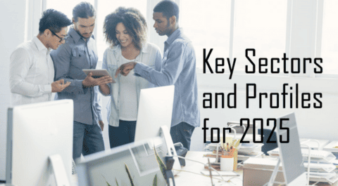 Grupo de profesionales reunidos en oficina moderna, analizando datos en tablet, con texto superpuesto “Key Sectors and Profiles for 2025”. onhunters, firma de búsqueda y selección de personal.